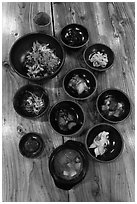 Meal with assorted kim-chi. Jeju Island, South Korea ( black and white)