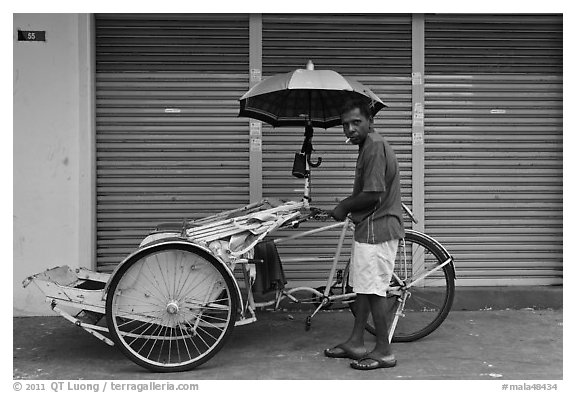 Driver and trishaw. George Town, Penang, Malaysia