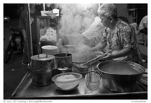 Noddles prepared on foodstall by night. George Town, Penang, Malaysia