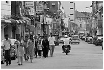 Malay people walking on street. George Town, Penang, Malaysia ( black and white)