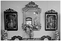 Portraits and mirors, Pinang Peranakan Mansion. George Town, Penang, Malaysia (black and white)