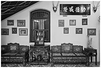 Antique furniture and images, Pinang Peranakan Mansion. George Town, Penang, Malaysia ( black and white)