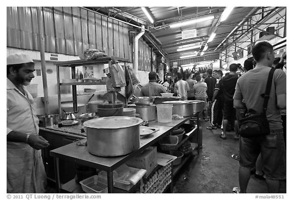 People waiting in line at popular eatery. George Town, Penang, Malaysia (black and white)