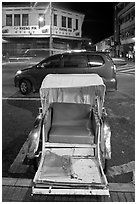 Rickshaw and auto at night. George Town, Penang, Malaysia (black and white)