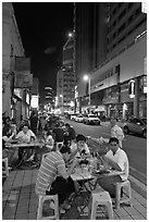 Street restaurant at night, Chinatown. Kuala Lumpur, Malaysia ( black and white)