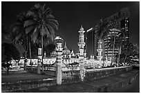 Masjid Jamek mosque and palm tree grove at night. Kuala Lumpur, Malaysia ( black and white)