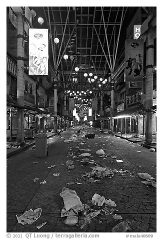 Jalan Petaling street with rubbish from market. Kuala Lumpur, Malaysia (black and white)