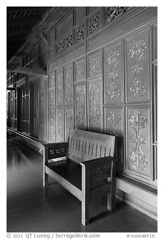 Wood panel and chair, sultanate palace. Malacca City, Malaysia (black and white)
