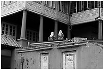 Stadthuys detail with two women. Malacca City, Malaysia ( black and white)