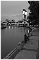 Melaka River river quay at dusk. Malacca City, Malaysia ( black and white)