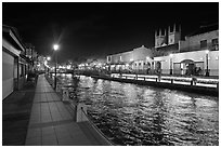 Melaka River at night with St Peters Church towers. Malacca City, Malaysia ( black and white)