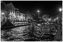 Tour boats on Melaka River at night. Malacca City, Malaysia (black and white)