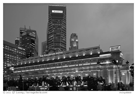 Fullerton Hotel and high rises at dusk. Singapore (black and white)