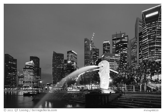 Merlion fountain and skyline at dusk. Singapore (black and white)