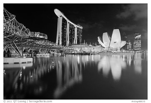 Helix Bridge, Marina Bay Sands, and ArtScience Museum at night. Singapore (black and white)