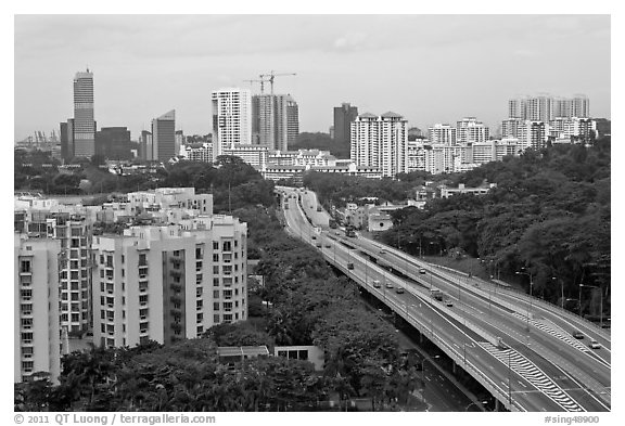 Freeway bordered by parklands and high rises. Singapore