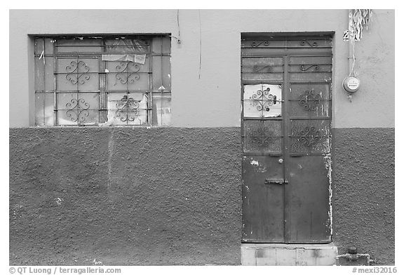 Multicolored wall, window, and door. Guadalajara, Jalisco, Mexico (black and white)