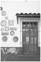 Wall decorated with colorful ceramic pieces, Tlaquepaque. Jalisco, Mexico ( black and white)