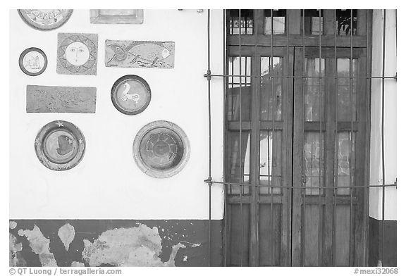 Wall decorated with colorful ceramic pieces, Tlaquepaque. Jalisco, Mexico (black and white)