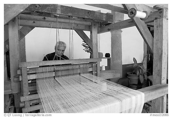 Weaver operating a traditional machine, Tlaquepaque. Jalisco, Mexico (black and white)