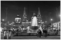 Plaza de la Liberacion with fountain and Cathedral by night. Guadalajara, Jalisco, Mexico (black and white)