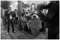 Mariachi musicians performing a serenade at the Parian, Tlaquepaque. Jalisco, Mexico ( black and white)