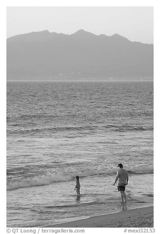 Man and child on the beach at sunset, Nuevo Vallarta, Nayarit. Jalisco, Mexico (black and white)