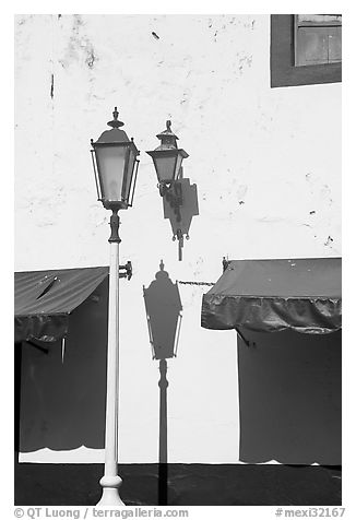 Wall with lamps, blue shades and blue painting, Puerto Vallarta, Jalisco. Jalisco, Mexico (black and white)