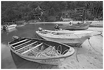 Small boats beached in a lagoon in fishing village, Boca de Tomatlan, Jalisco. Jalisco, Mexico ( black and white)