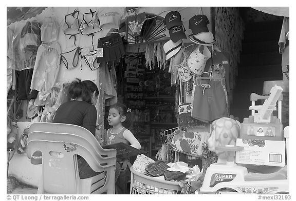 Woman and girl outside a store,  Boca de Tomatlan, Jalisco. Jalisco, Mexico (black and white)