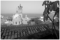 Red-tiled roof and Templo de Guadalupe Cathedral, early morning, Puerto Vallarta, Jalisco. Jalisco, Mexico ( black and white)