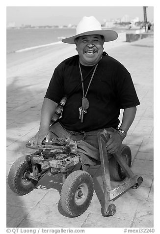 Man without legs  smiling on the Malecon, Puerto Vallarta, Jalisco. Jalisco, Mexico