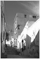 Man walking down stairs of Cajaon de Garcia Rojas. Zacatecas, Mexico (black and white)