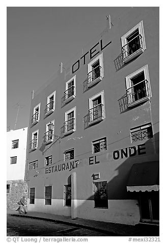 Hotel restaurant building painted bright blue and yellow. Guanajuato, Mexico (black and white)