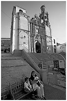 Woman and child waiting for bus below a church. Guanajuato, Mexico ( black and white)