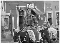 Young man riding a donkey in the streets. Guanajuato, Mexico ( black and white)
