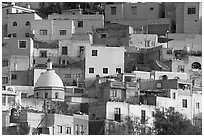 Multicolored houses on a steep hillside, late afternoon. Guanajuato, Mexico ( black and white)