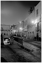Juarez street and subterranean street with bus at night. Guanajuato, Mexico (black and white)