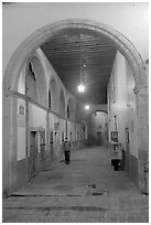 Man walking in an arched passage a dawn. Guanajuato, Mexico ( black and white)