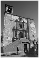 People walking in front of church San Roque, early morning. Guanajuato, Mexico ( black and white)