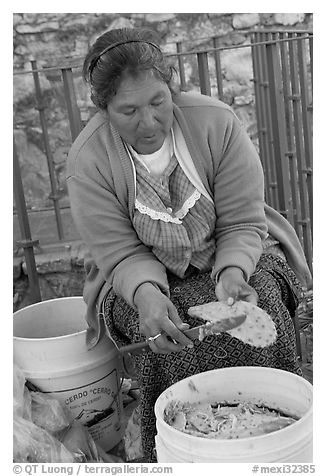 Woman peeling cactus. Guanajuato, Mexico (black and white)