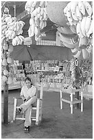 Woman sitting in a fruit stand. Mexico ( black and white)