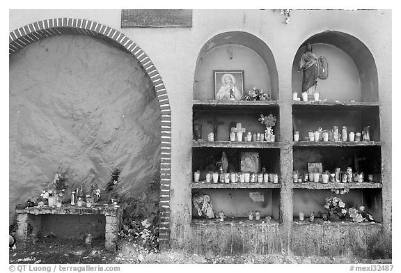 The exterior wall of a roadside chapel. Mexico (black and white)