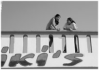 Young women sitting on a roof. Mexico ( black and white)
