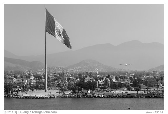 Giean Mexican national flag flying above Malecon, Ensenada. Baja California, Mexico