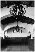 Ballroom and intricate ironwork in heavy chandeliers, Riviera Del Pacifico, Ensenada. Baja California, Mexico ( black and white)