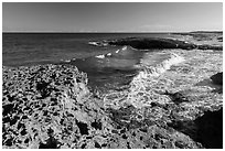 Surf and rock with holes. Cozumel Island, Mexico ( black and white)