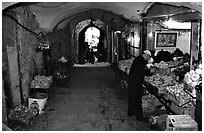 Fruit and vegetable store in an old town archway. Jerusalem, Israel ( black and white)