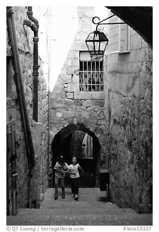 Children on stairs of an old alley. Jerusalem, Israel