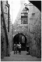 Children on stairs of an old alley. Jerusalem, Israel (black and white)